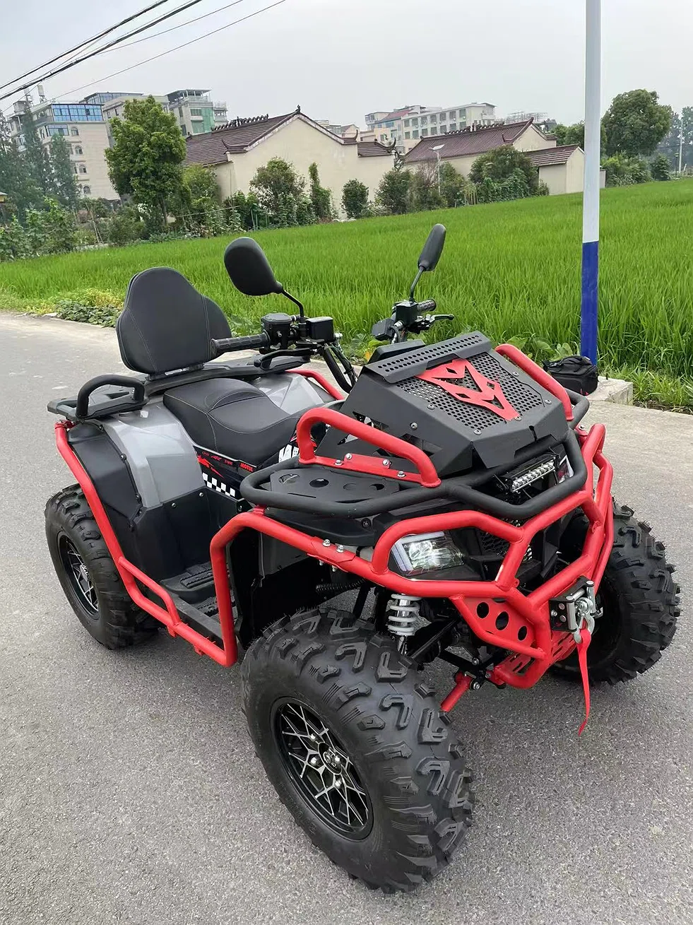 Red and black MADEMOTO four-wheel all-terrain vehicle ATV
